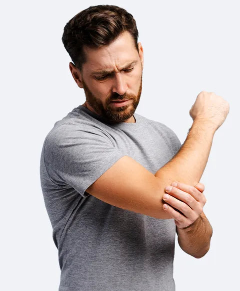 A man holding his arm at the elbow